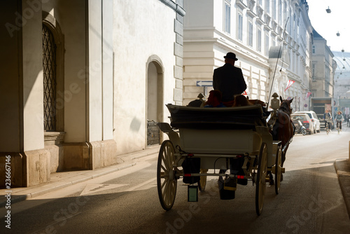 Foto Horse carriage on old city street