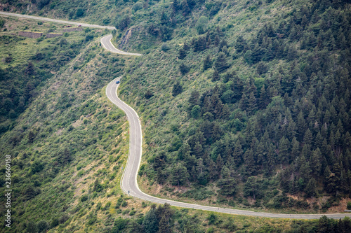 Fototapeta Naklejka Na Ścianę i Meble -  Aerial view of a Winding road from the high mountain pass in Pyrenees