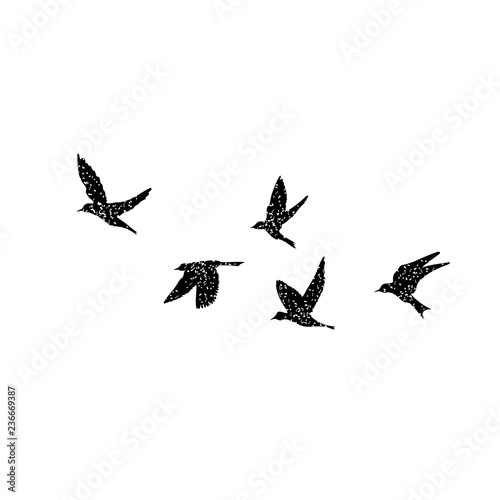 Isolated textured stipple silhouette of birds flock in the air Inspirational body flash tattoo ink. Vector.