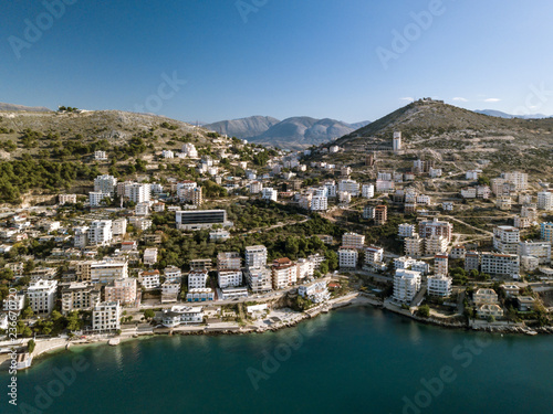 View of Saranda city and lekuresi hill with the castle on top captured with a drone. touristic attraction in Balkan . Ionian sea Mediterranean area. Sarande Albania  © A Daily Odyssey