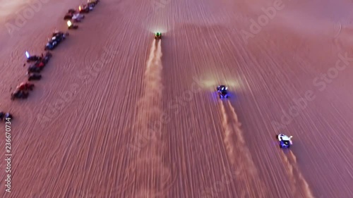 Dune buggies take off in a drag race through the desert