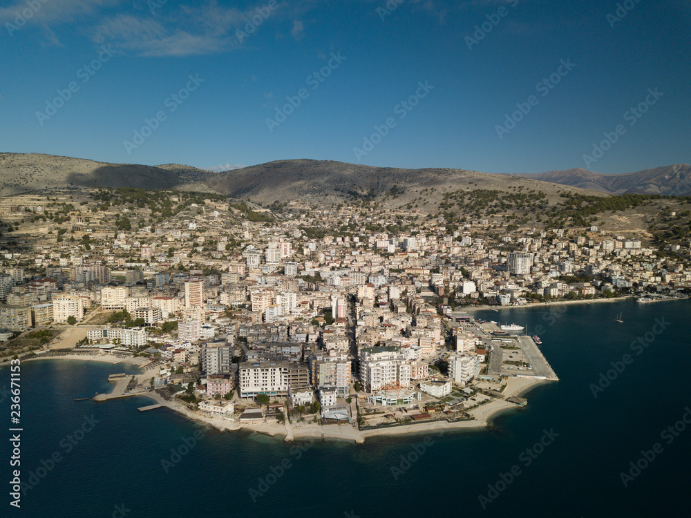 Beautiful aerial view of the touristic European city of Saranda located in south Albania . Mediterranean area  