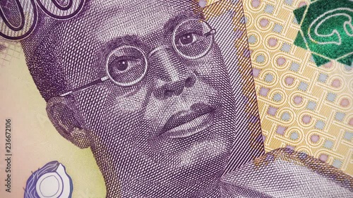 Nigeria 100 naira (2014) banknote rotating, Nigerian money close up.  4K UHD video footage photo