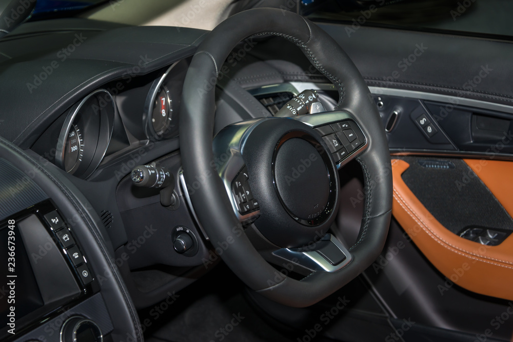 Steering wheel in modern luxury car interior