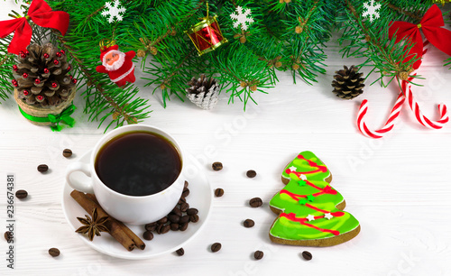 Christmas tree on a white background and a cup of coffee