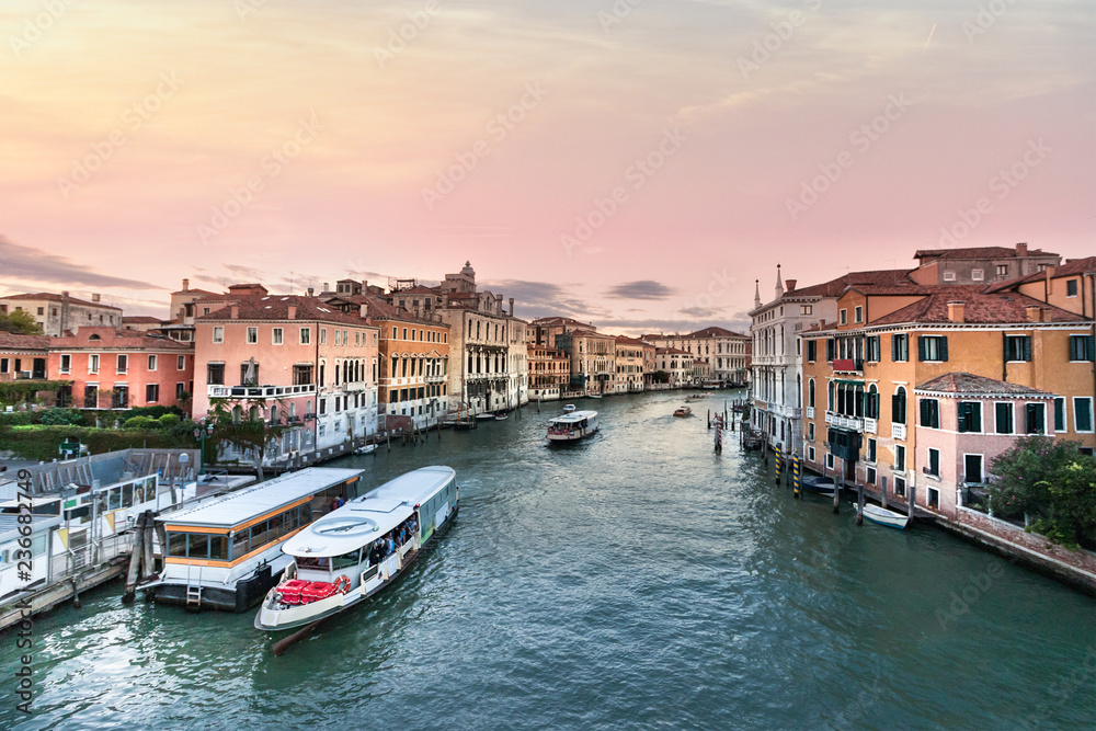 View of the Grand Canal with Vaporetto stop Venice at evening, Italy.