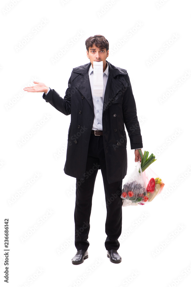 Young handsome man with vegatables in shopping concept Young handsome man with vegatables in shopping concept