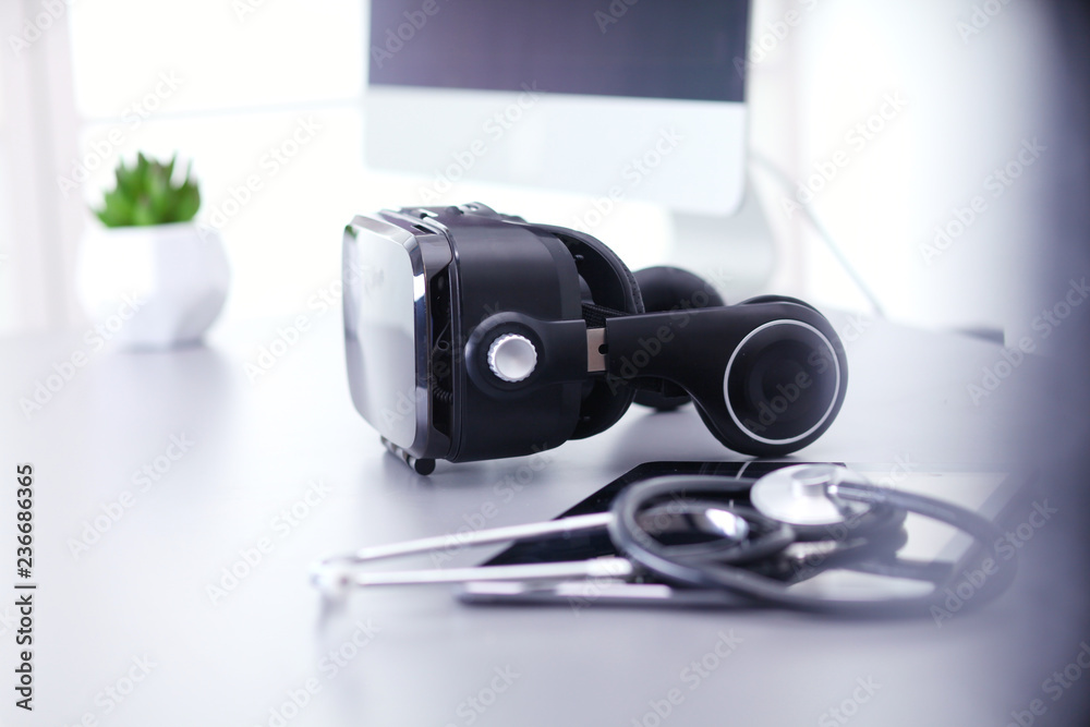 Virtual reality goggles on desk with laptop. business. 3d technology Virtual reality goggles on desk with laptop. business. 3d technology