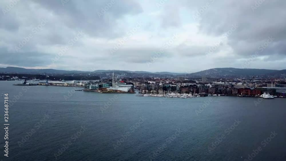 Speeding up approaching aerial drone shot of Aker Brygge and Astrup museum in Oslo, Norway Speeding up approaching aerial drone shot of Aker Brygge and Astrup museum in Oslo, Norway