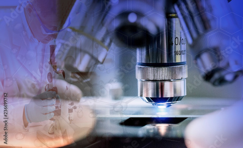 Close-up shot of microscope with metal lens at laboratory