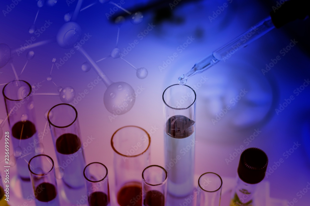 science research concept,Dropping chemical liquid to test tube in chemical laboratory