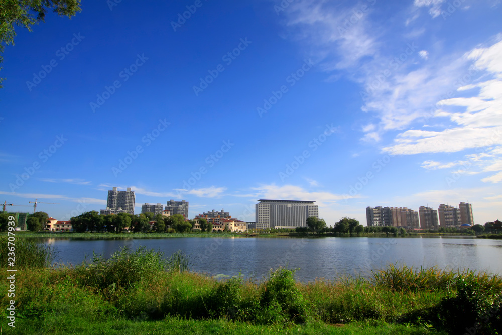 city scenery, buildings stand beside the river