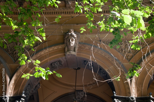Photography Sydney Australia, arch with sandstone carving of ladies head on Victorian buildi