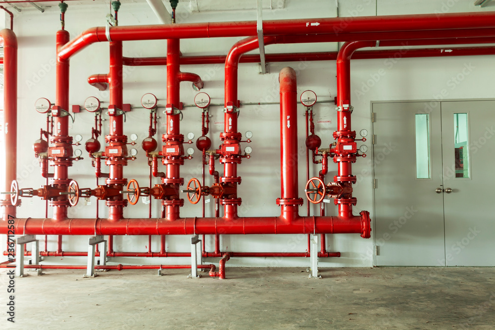 Red water pipe valve,pipe for water piping system control and Fire control system in industrial building or business building - obrazy, fototapety, plakaty 
