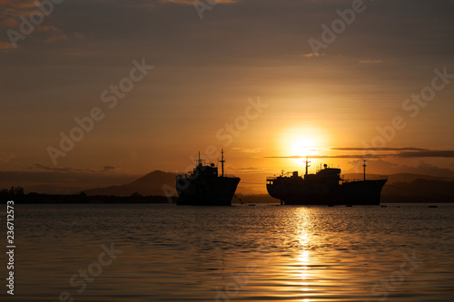 Beautiful sunrise seascape view with boat in phuket island. © panya99