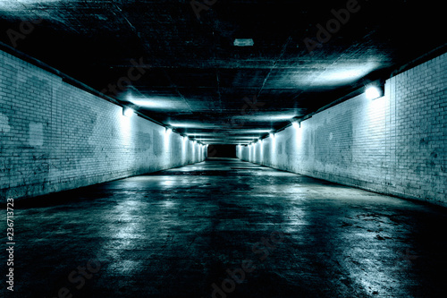 Empty underground tunnel at night