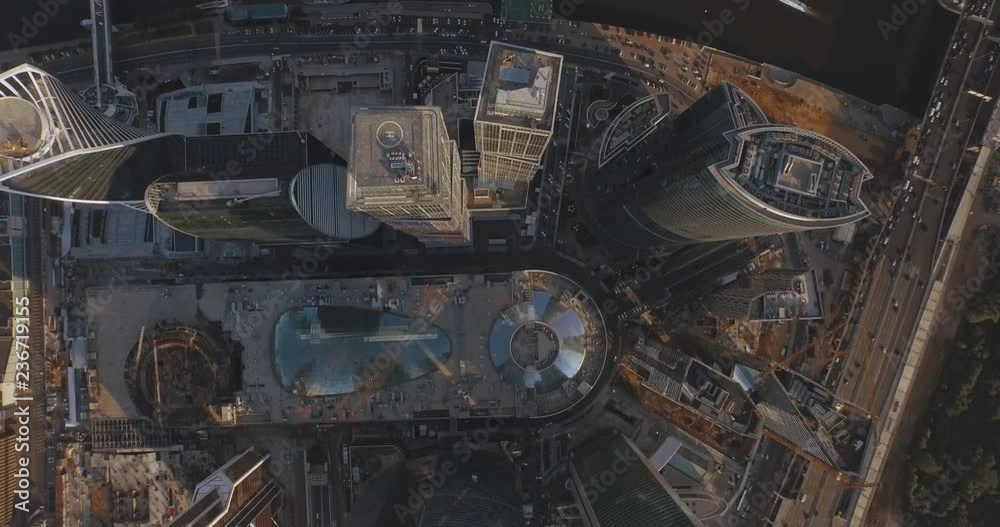 Business center Moscow City, aerial photography on the drone. Skyscrapers of glass and concrete in Moscow. Business center in the summer sun and surrounded by greenery. Kutuzovsky Prospect and Moscow Business center Moscow City, aerial photography on the drone. Skyscrapers of glass and concrete in Moscow. Business center in the summer sun and surrounded by greenery. Kutuzovsky Prospect and Moscow