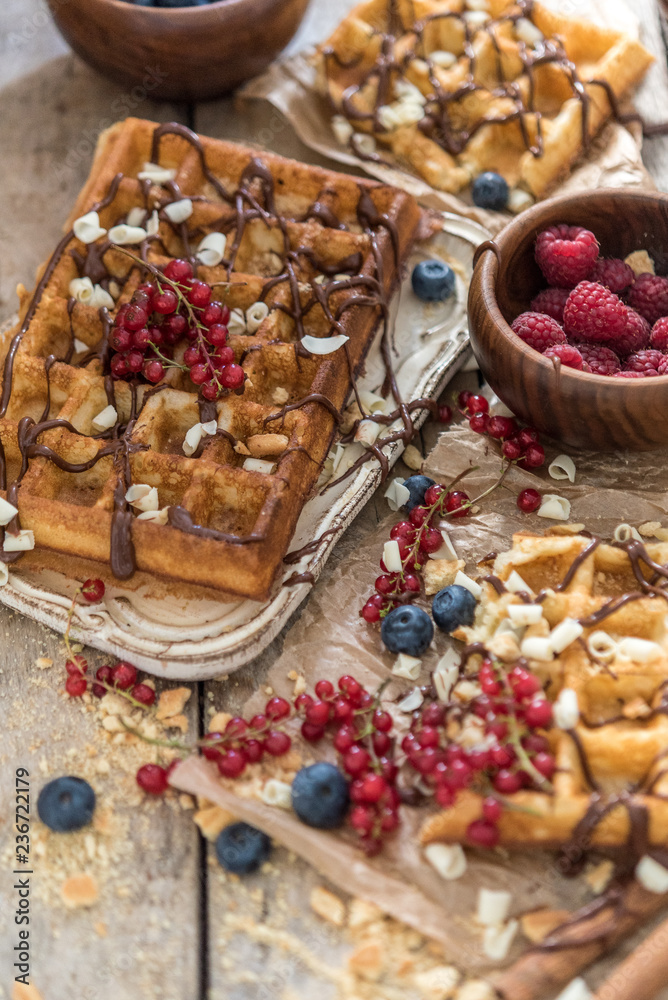 Top view of waffles with berries and chocolate Top view of waffles with berries and chocolate