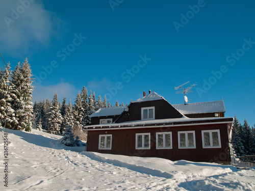 Cottage in the Giant Mountains, Czech Republic. Sunny day during winter.