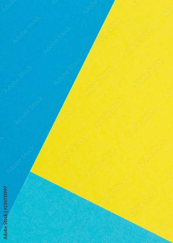 Color papers geometry flat composition background with yellow and blue tones Color papers geometry flat composition background with yellow and blue tones