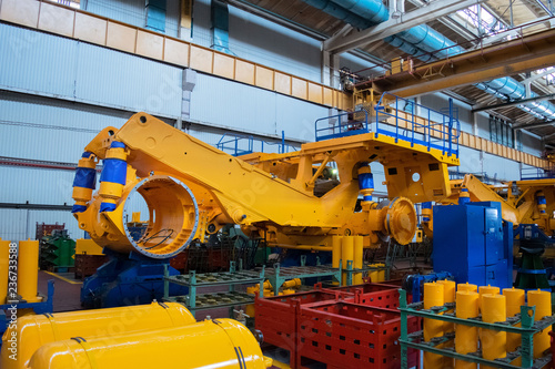 Line, conveyor for the production of large yellow trucks, mining trucks.