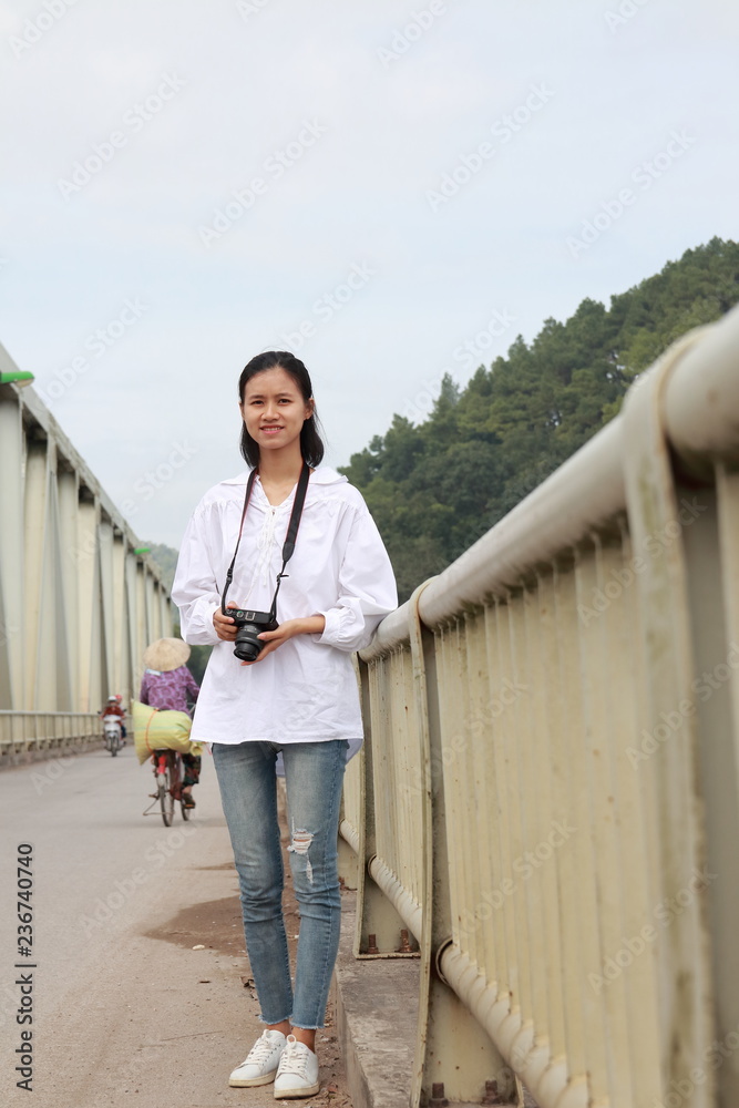 woman traveling to Ham Rong Bridge in Thanh Hoa, Vietnam