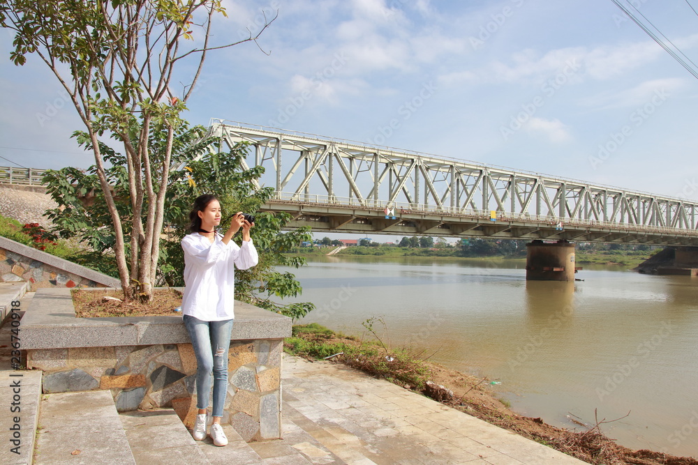 woman traveling to Ham Rong Bridge in Thanh Hoa, Vietnam