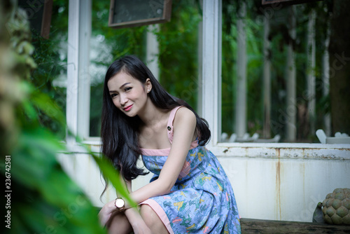 Asian pretty girl has relaxing with happy and smiling at Little Tree Garden cafe, Nakhon Pathom province, Thailand in the morning. Free Download Asian pretty girl has relaxing with happy and smiling at Little Tree Garden cafe, Nakhon Pathom province, Thailand in the morning. - GFXLoad