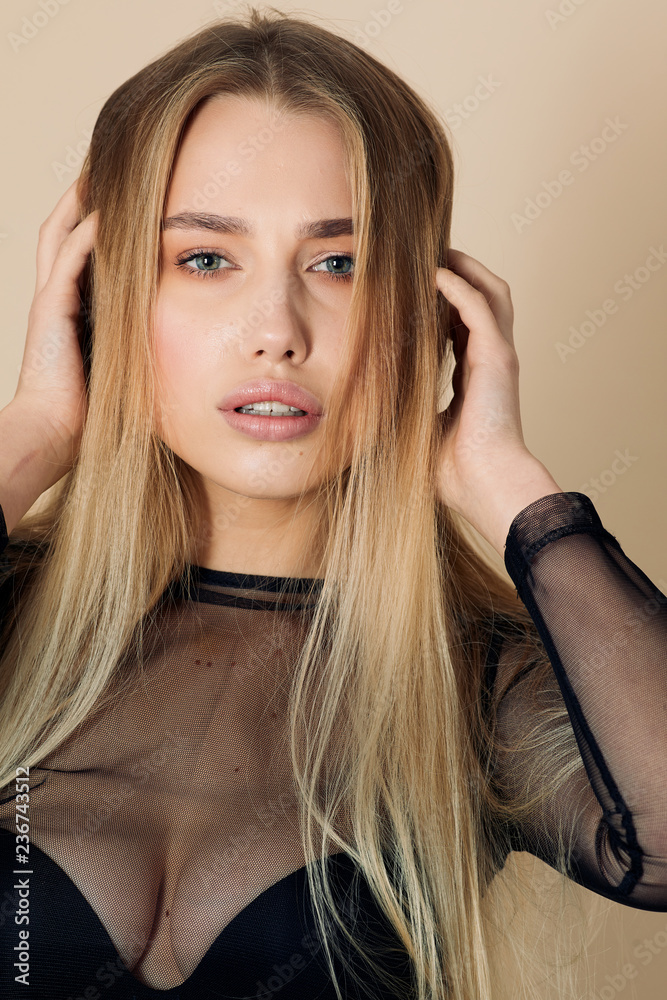 Pretty girl pose to camera in yellow background studio Pretty girl pose to camera in yellow background studio