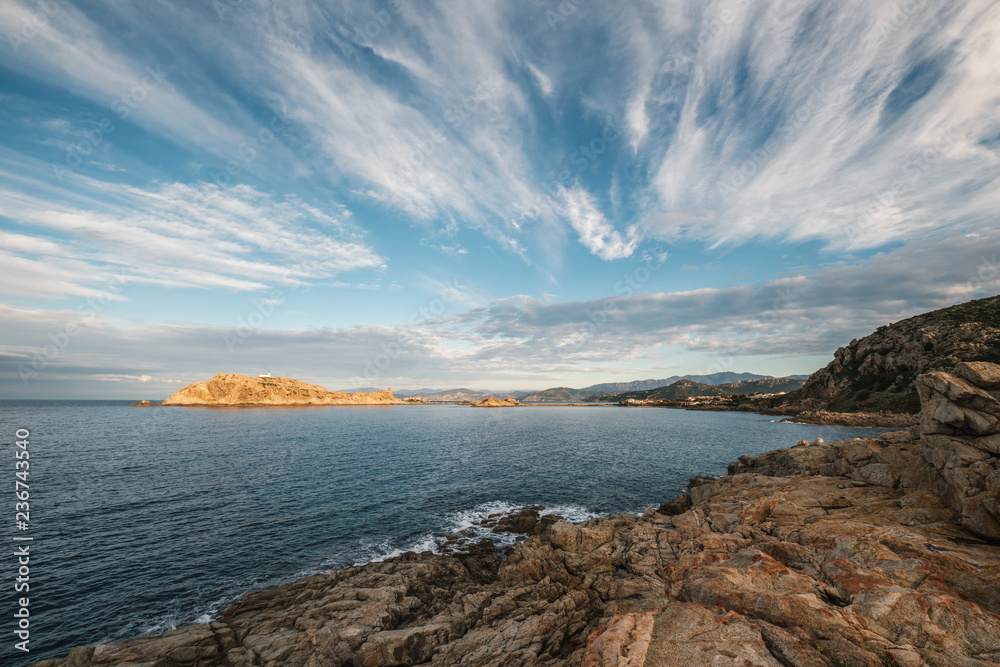 Evening sun on red rock of Ile Rousse in Corsica