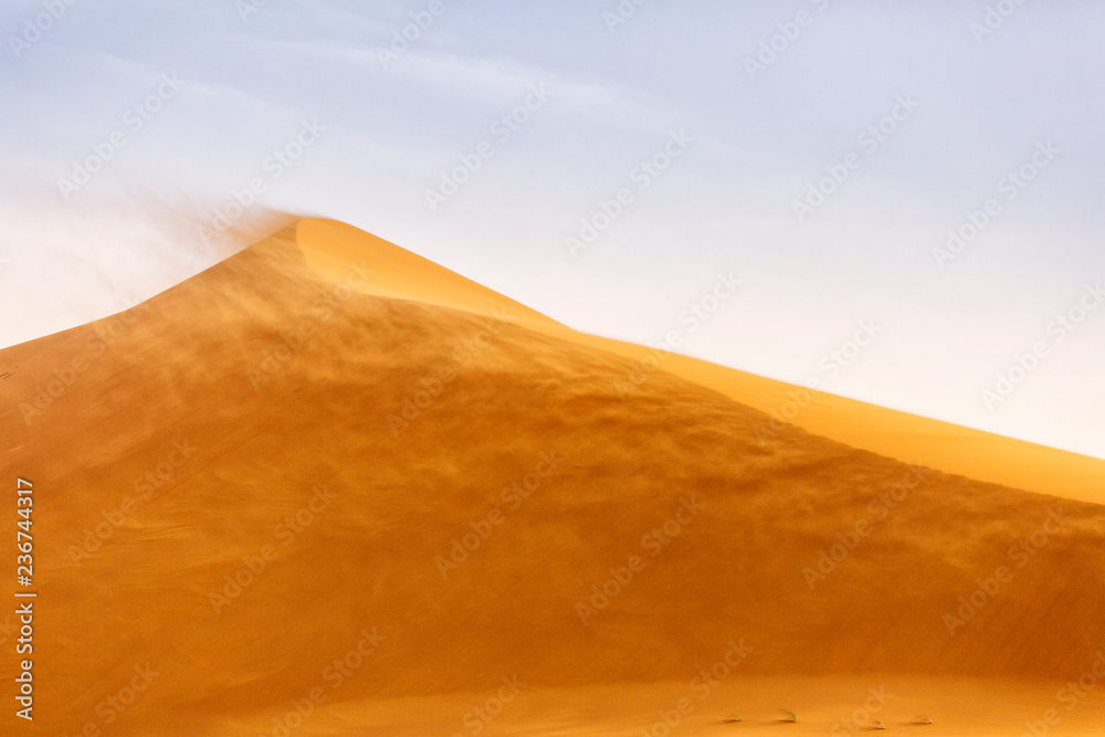 Dunes in Desert Sahara in Merzouga, Morocco. Beautiful lines of desert with sky in background Dunes in Desert Sahara in Merzouga, Morocco. Beautiful lines of desert with sky in background