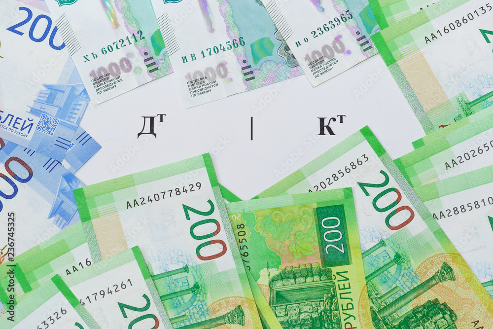The symbol on the Russian language the Debit and Credit and the new Russian banknotes around The symbol on the Russian language the Debit and Credit and the new Russian banknotes around