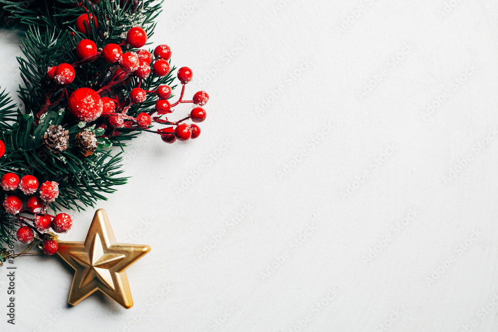 Christmas decorative wreath of holly, ivy, mistletoe, cedar and leyland leaf sprigs with red berries over white background. Christmas decorative wreath of holly, ivy, mistletoe, cedar and leyland leaf sprigs with red berries over white background.