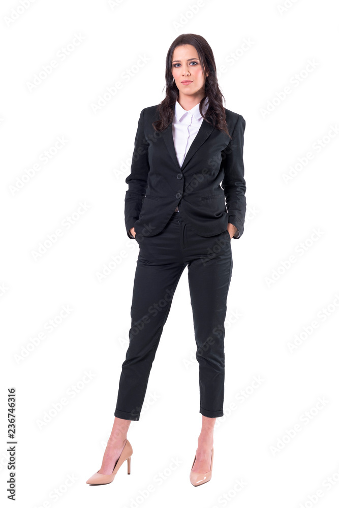 Beautiful and successful business woman with hands in pockets standing. Full body isolated on white background. Beautiful and successful business woman with hands in pockets standing. Full body isolated on white background.