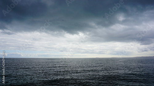 sea with blue sky and clouds