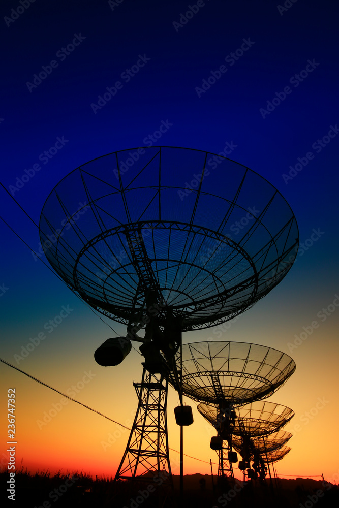 The silhouette of a radio telescope observatory The silhouette of a radio telescope observatory