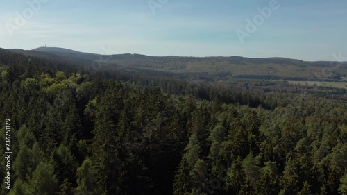 4K aerial shot of forrest and village on a mountain 