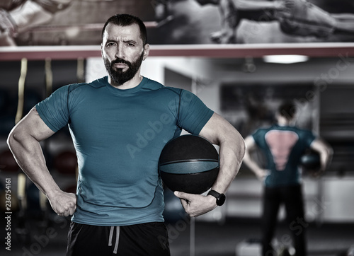 Fitness trainer with medicine ball