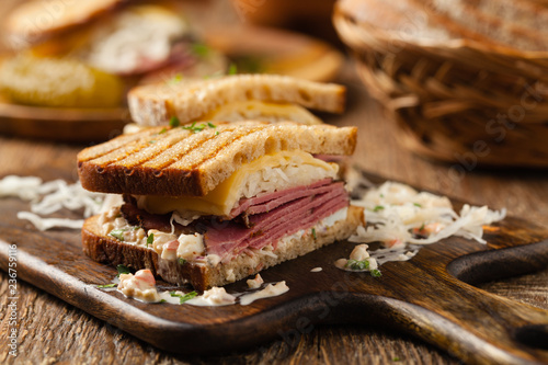 Ruben sandwich. New York sandwich with pastrami, sauce 1000 islands and sauerkraut. photo