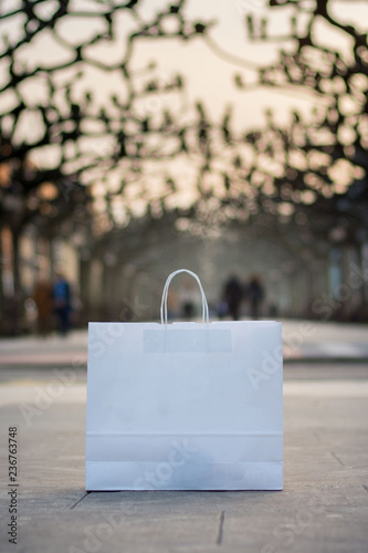 White bag in street