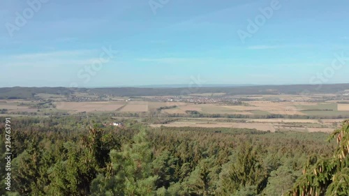 4K aerial shot of forrest and village on a mountain