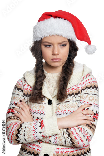 Portrait of sad young woman in Christmas hat 