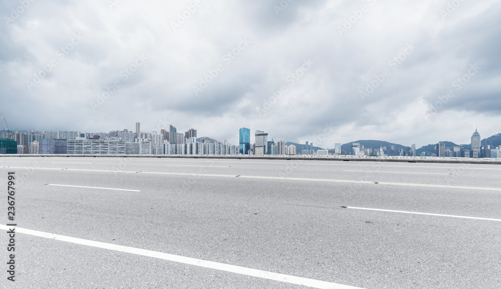 Panoramic skyline and buildings with empty road Panoramic skyline and buildings with empty road