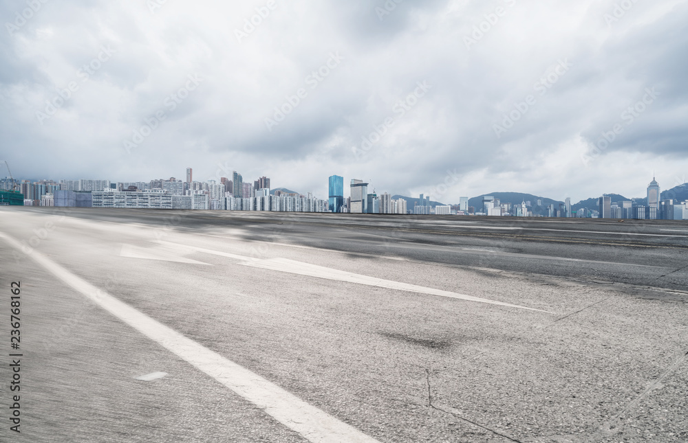 Panoramic skyline and buildings with empty road Panoramic skyline and buildings with empty road