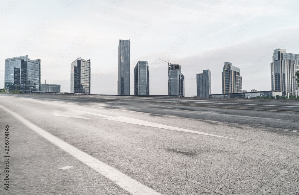 Panoramic skyline and buildings with empty road Panoramic skyline and buildings with empty road