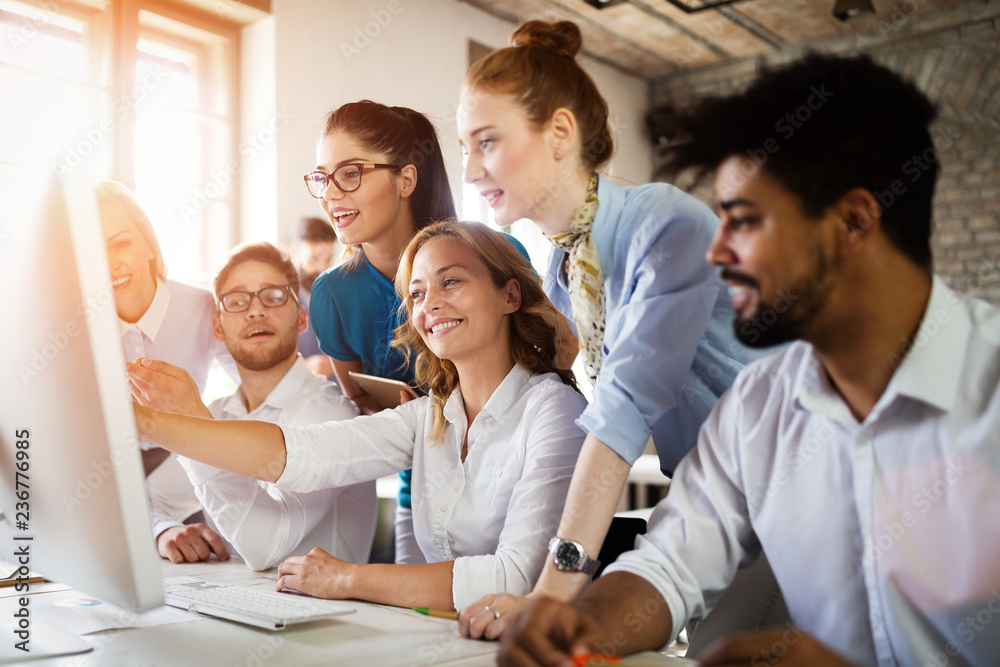 Group of young businesspeople or designers work with new startup project in office