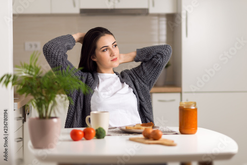 Canvastavla Beautiful woman stretching during breakfast time in the morning