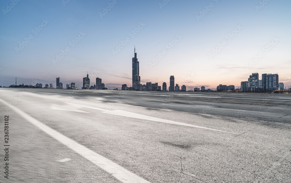 Panoramic skyline and buildings with empty road 