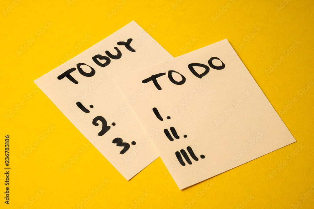 Concept tasks for the day what to buy and do. Yellowish stickers with inscriptions on a yellow background. Concept tasks for the day what to buy and do. Yellowish stickers with inscriptions on a yellow background.