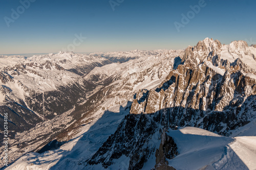 View over the French Alps, from the Aiguille du Midi cable on a winter afternoon, just before Christmas.